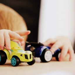 A child playing with toy cars