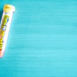 EpiPens against a blue background.