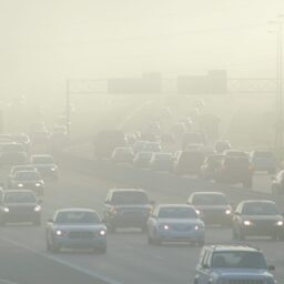 Smog during rush hour traffic on a busy highway.