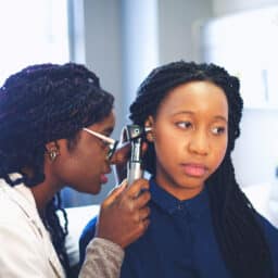 Woman getting an ear exam