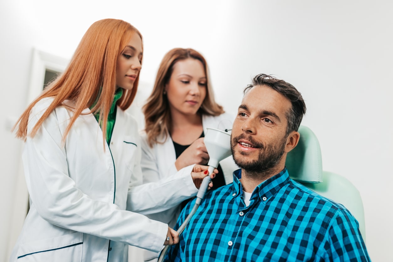 Earwax removal with two ENT providers.