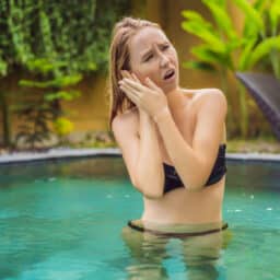 Woman in pool has water stuck in ear