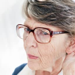 Senior woman straining to hear