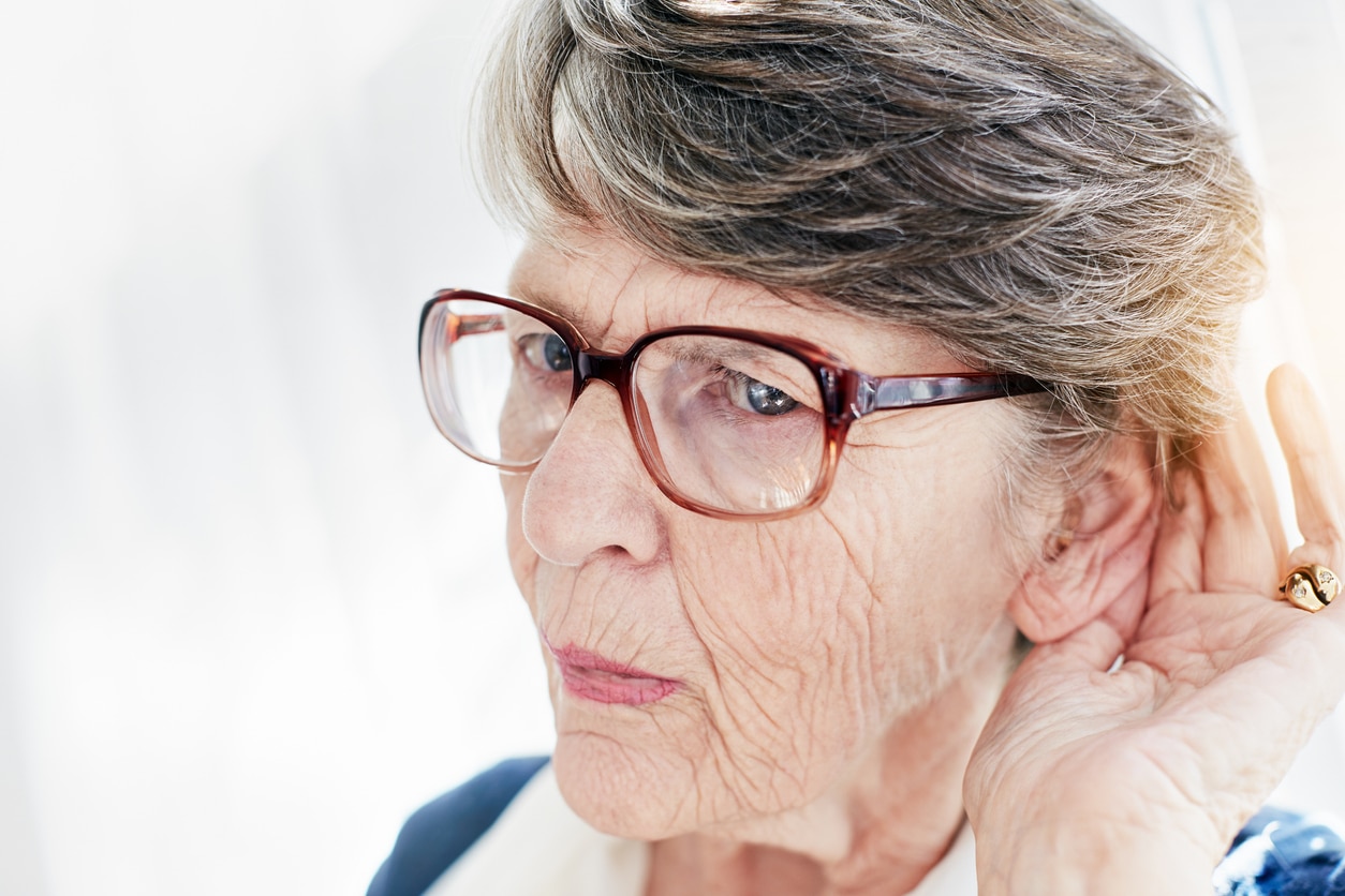 Senior woman straining to hear.