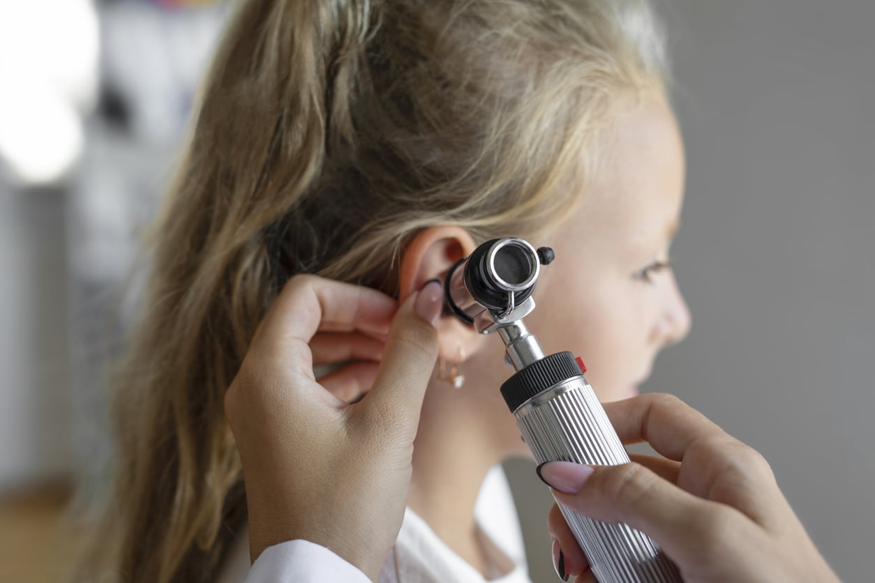 Young girl has ear examined