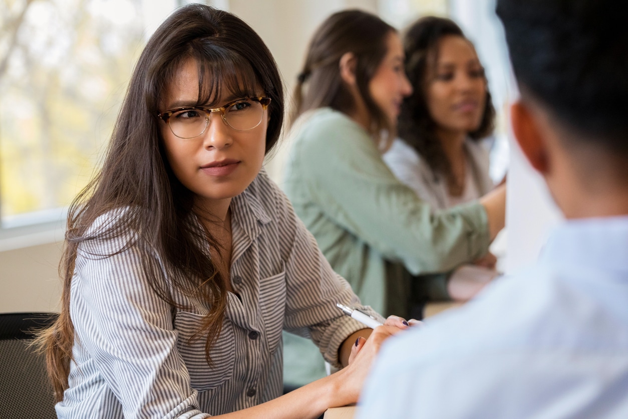 Woman struggling to understand someone.