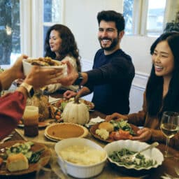 Smiling group of friends celebrating Thanksgiving together