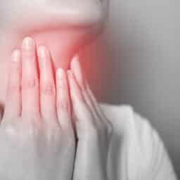 Woman with a red sore throat