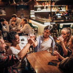 Group of friends hanging out in a bar