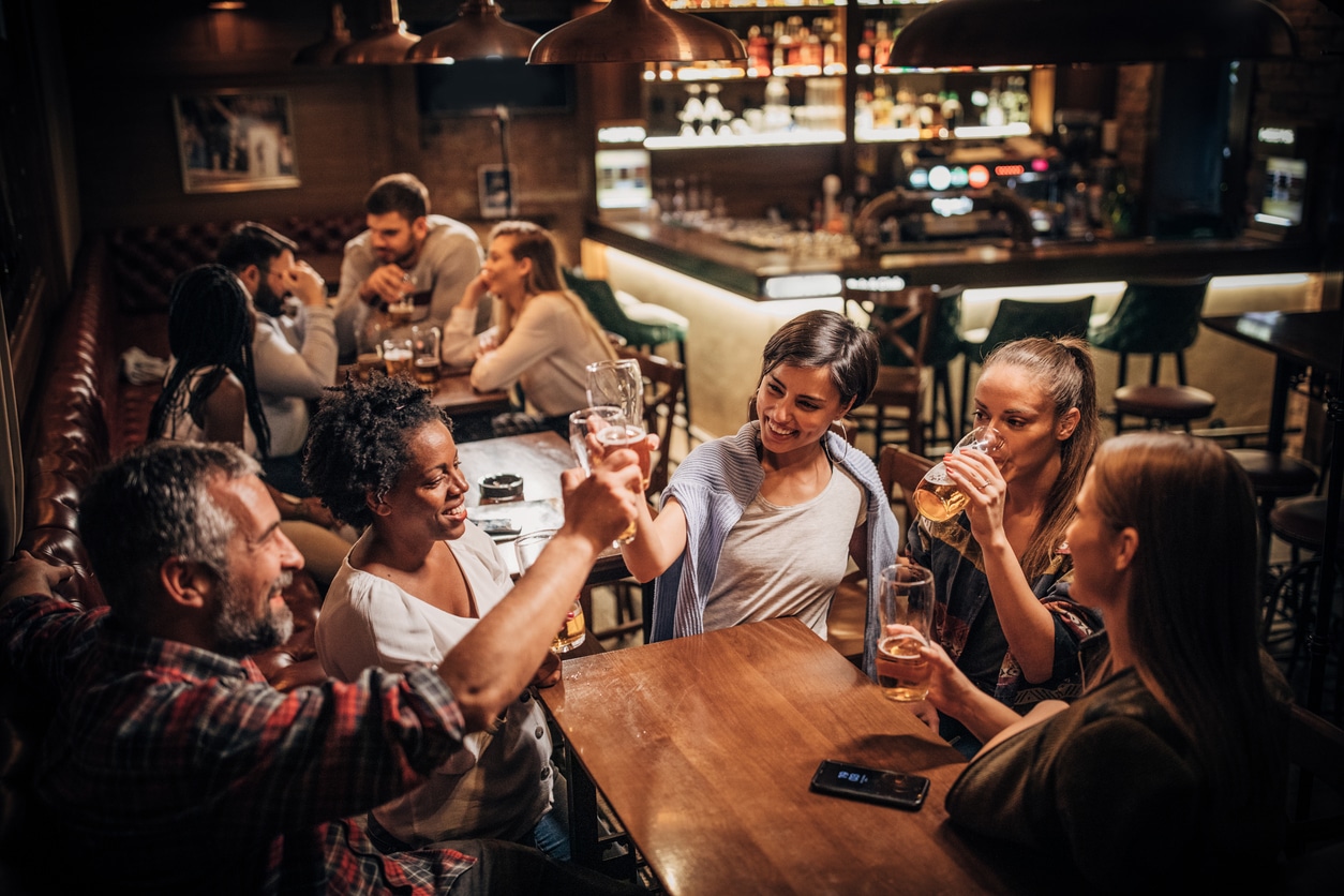 Group of friends hanging out in a bar