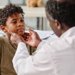 Young boy gets neck examined